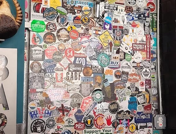 stickers on the beer cooler at walter's 303 uptown